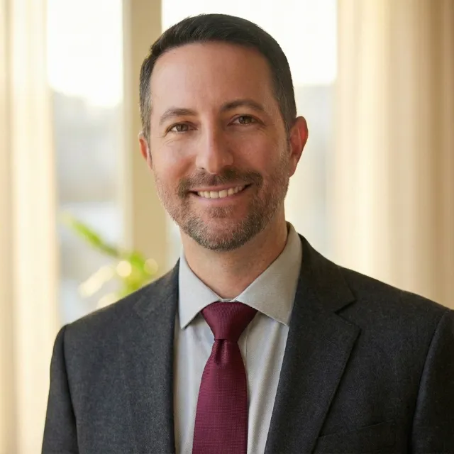Warm toned headshot photo of Kevin J Kristick, Partner at Bosse Rollman PC