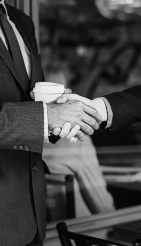 Men suits shaking hands
